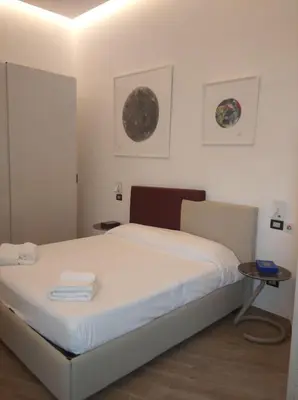 Letto o letti in una camera di Neruda Chic House Vomero