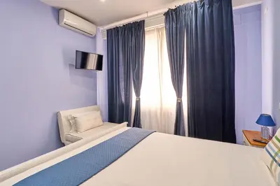 Letto o letti in una camera di La Marina