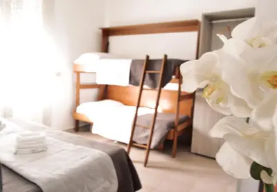 Letto o letti in una camera di Hotel Colombo