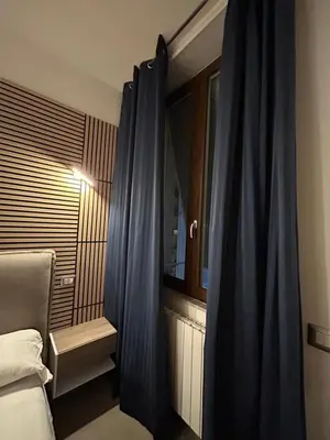 Letto o letti in una camera di International Naples