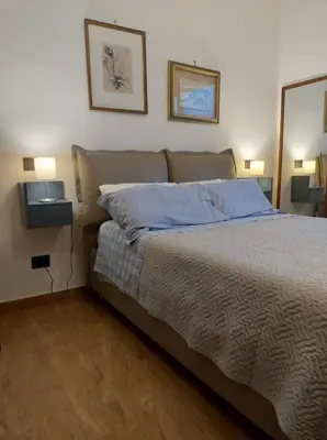 Letto o letti in una camera di RICOMINCIO DA ME