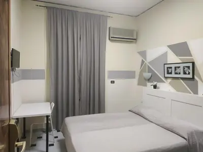 Letto o letti in una camera di Hotel Luna Rossa