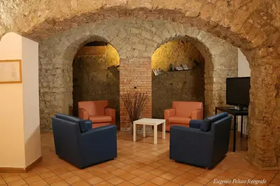 Area soggiorno di Caravaggio Hotel