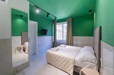 Letto o letti in una camera di P.C. Boutique H. Vesuvius, Napoli Centro, by ClaPa Group