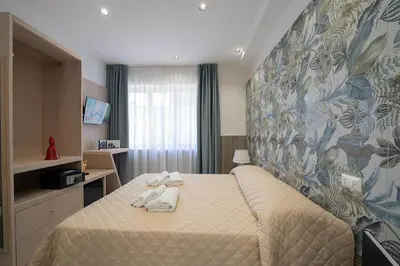 Letto o letti in una camera di P.C. Boutique H. Vesuvius, Napoli Centro, by ClaPa Group