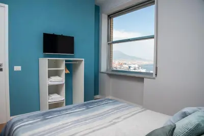 Letto o letti in una camera di 12TH FLOOR NAPOLI