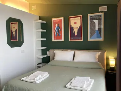 Letto o letti in una camera di Le Petit Palais - Naples