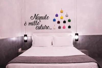Letto o letti in una camera di A un passo dal Castello Maschio ANGIOINO Appartment