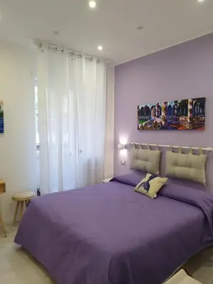 Letto o letti in una camera di B&B Molo Partenope