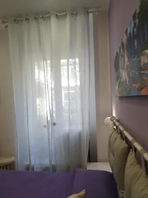 Letto o letti in una camera di B&B Molo Partenope