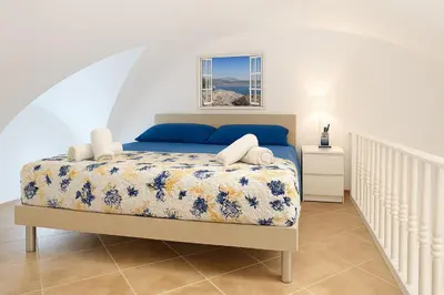 Letto o letti in una camera di Oikos Guest House