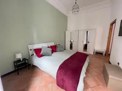 Letto o letti in una camera di La finestra sul corso