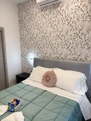 Letto o letti in una camera di Red Queen Naples