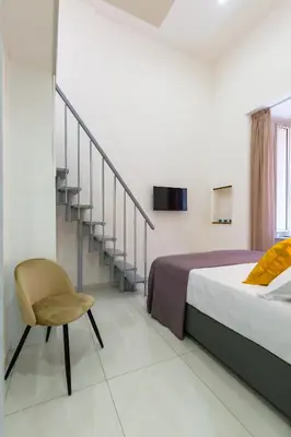 Letto o letti in una camera di Appartamentino ai Quartieri Spagnoli