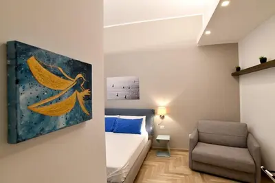 Letto o letti in una camera di Il Picchio di Chiaia