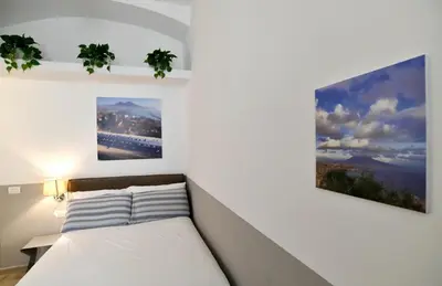 Letto o letti in una camera di Il Picchio di Chiaia