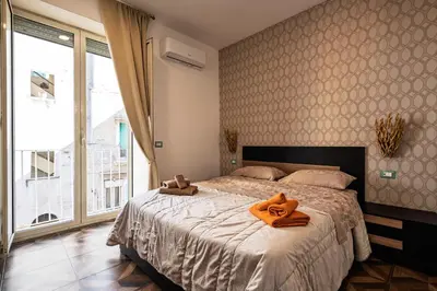 Letto o letti in una camera di Vacanze Partenopee - San Liborio