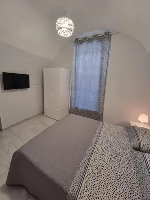 Letto o letti in una camera di Casa Gio’
