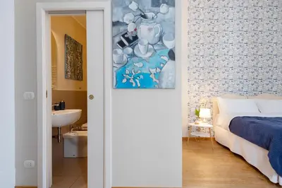 Letto o letti in una camera di B&B Donna Adelina