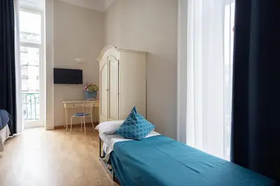 Letto o letti in una camera di B&B Donna Adelina
