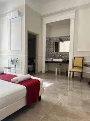 Letto o letti in una camera di Napolit'amo Hotel Principe