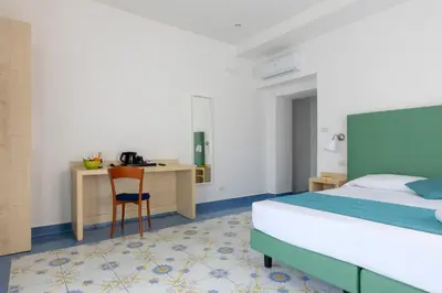Letto o letti in una camera di Napolit'amo Hotel Medina