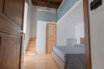 Letto o letti in una camera di Casa Materdei