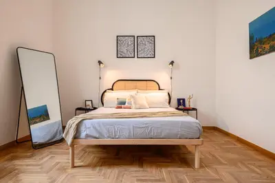 Letto o letti in una camera di Viale Calascione 7