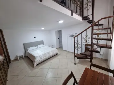Letto o letti in una camera di B&b casa (le porte di napoli)