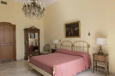 Letto o letti in una camera di Casa Bellevue