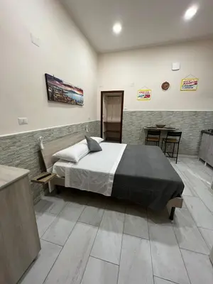 Letto o letti in una camera di La Casetta di Assunta