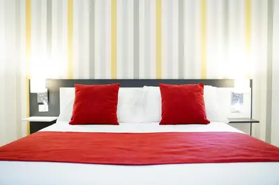 Letto o letti in una camera di Hotel Cimarosa