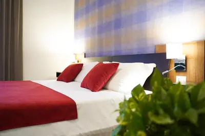 Letto o letti in una camera di Hotel Cimarosa