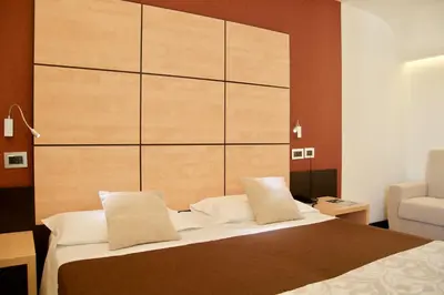 Letto o letti in una camera di Hotel Cimarosa