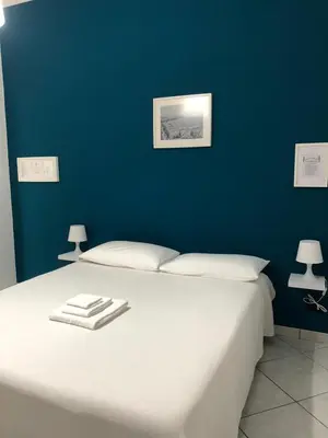 Letto o letti in una camera di Casa Maria