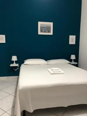 Letto o letti in una camera di Casa Maria