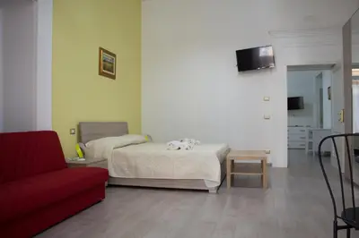 Letto o letti in una camera di Donna Laura Suite
