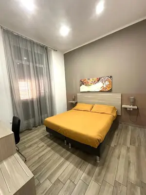 Letto o letti in una camera di Dimora Centrale Home