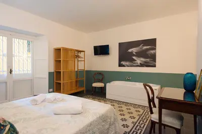Letto o letti in una camera di Vintage Suite Napoli