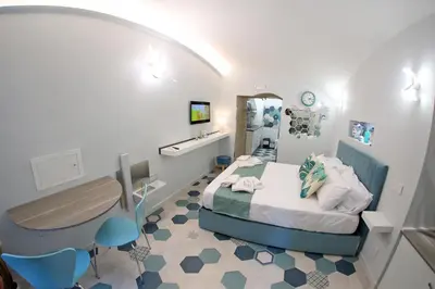 Letto o letti in una camera di Suite Na' poesia Mergellina
