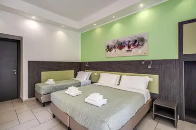 Letto o letti in una camera di Napoli Suite