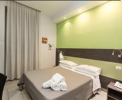 Letto o letti in una camera di Napoli Suite