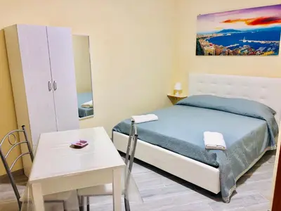 Letto o letti in una camera di Basso Sasà