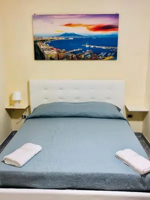 Letto o letti in una camera di Basso Sasà