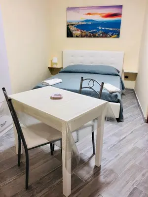 Letto o letti in una camera di Basso Sasà