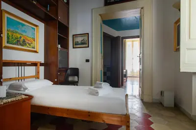 Letto o letti in una camera di Regal Santa Chiara By Dimorra