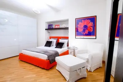 Letto o letti in una camera di Niparè Suite - Dimore Partenopee