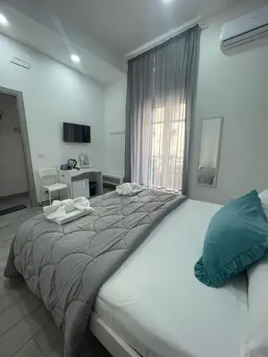 Letto o letti in una camera di B&B La Cumana
