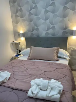 Letto o letti in una camera di B&B La Cumana