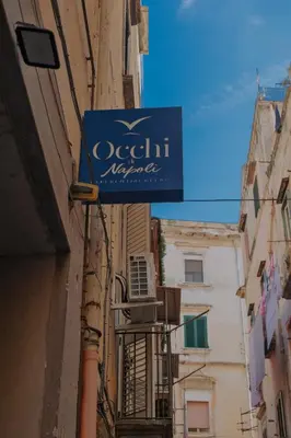 Certificato, attestato, insegna o altro documento esposto da Occhi di Napoli Experiential Relais